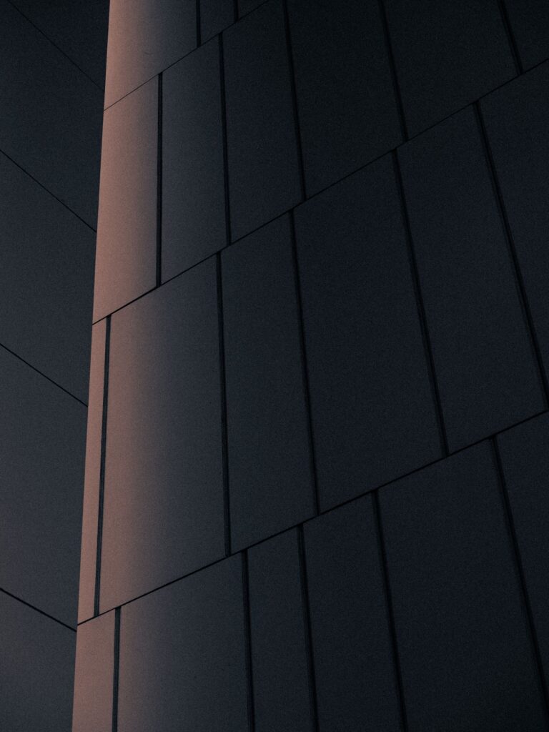 Building exterior with minimalist panels and subtle light