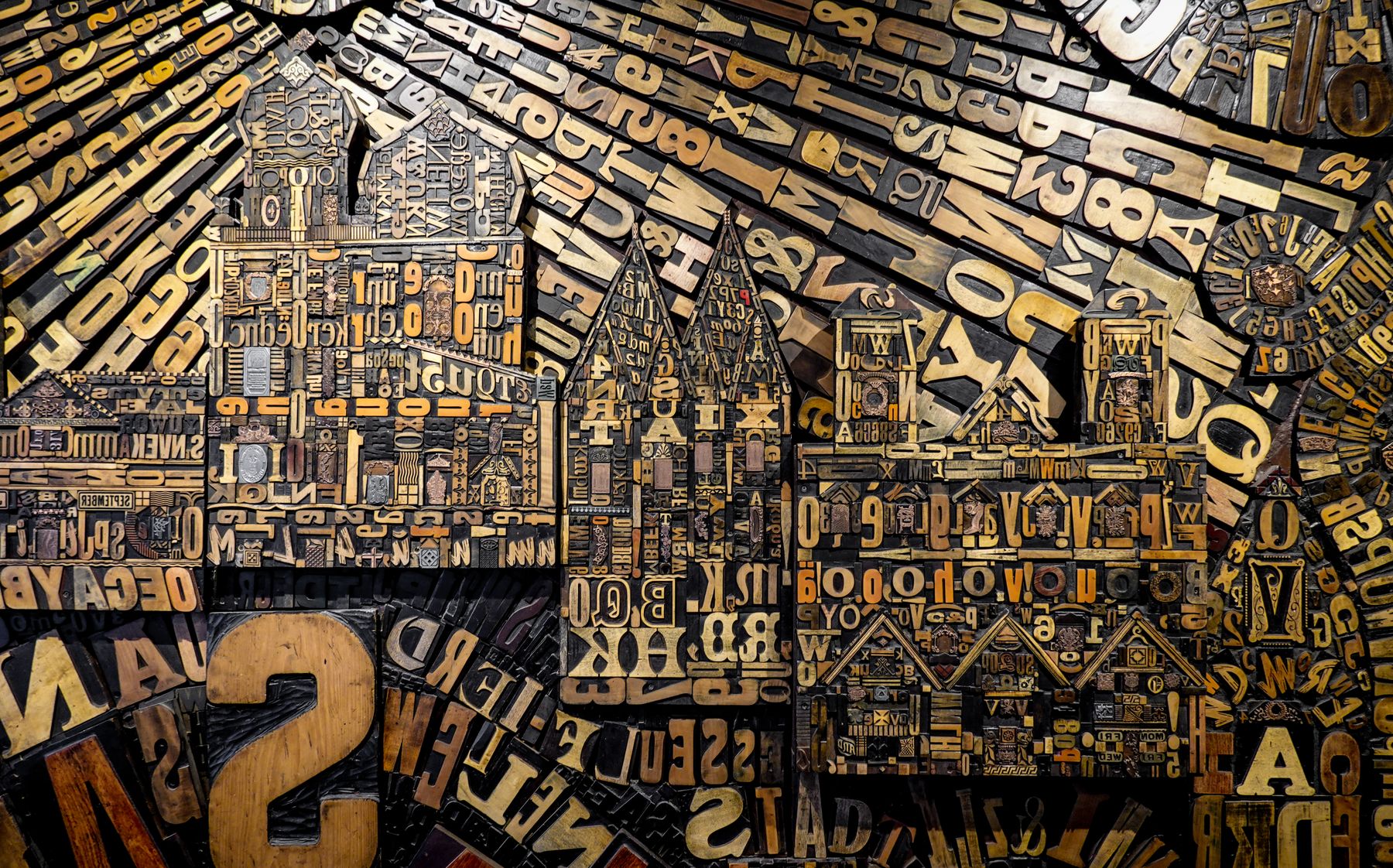 Wooden letterpress letters arranged as an artwork