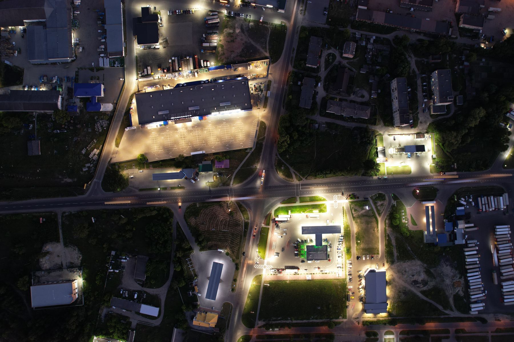 Aerial view of an illuminated city intersection at night